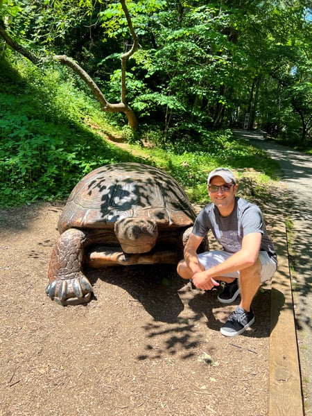 Tom with turtle sculpture at The WNC Nature Center