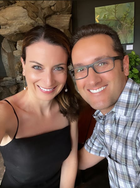 Christine and Tom, a white brunette male and female taking selfie and she is in a black dress and he is wearing a plaid shirt at Edison Restaurant at the Grove Park Inn in Asheville NC